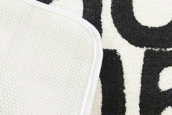 Gros plan du support du coussin de bain en peluche